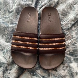 BRAND NEW NEVER WORN size 6 black and gold slides